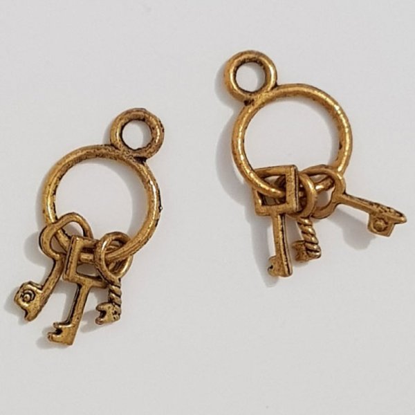 Key Charm N&deg;01 gammelt guld