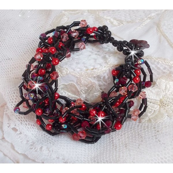 Feeling armb&aring;nd med r&oslash;rperler, perlemorsperler og Swarovski krystal snurrende toppe