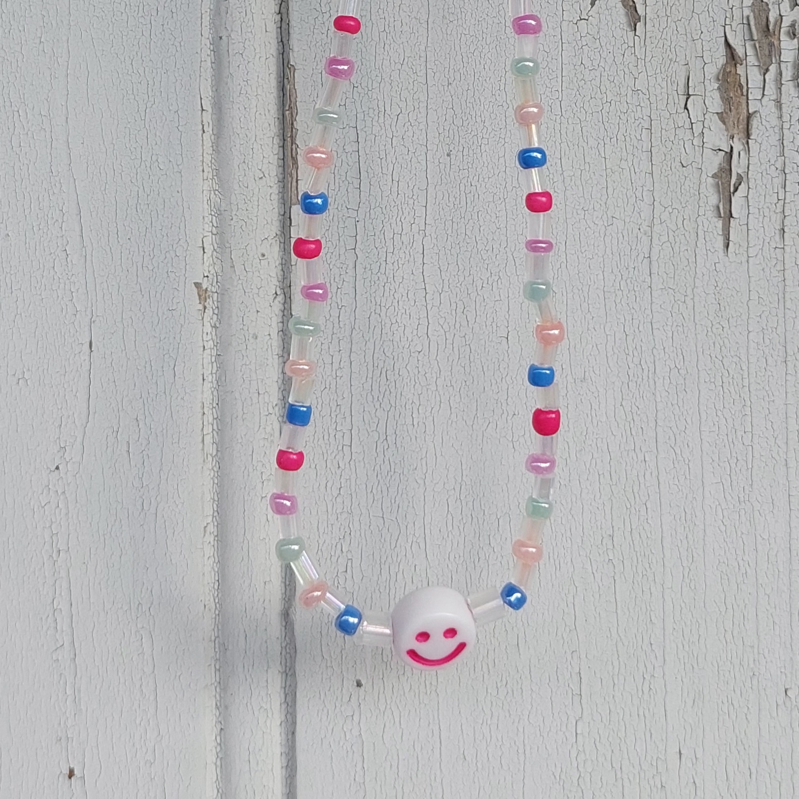 Ras du cou Smiley couleur pastel